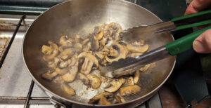 cooking mushrooms in a pan